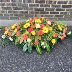 Orange and Yellow Funeral Casket Spray